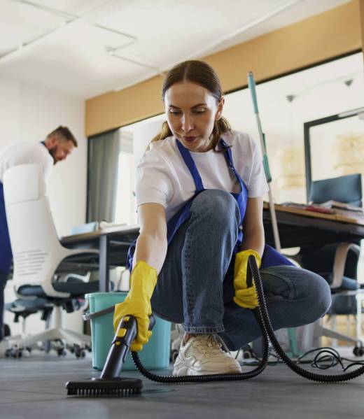 professional-cleaning-service-person-using-vacuum-cleaner-office